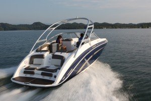 power boat speeding down the lake