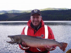 man holding a bull trout