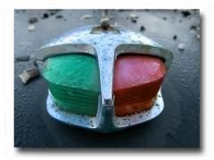 red and green navigation lights on the bow of a boat