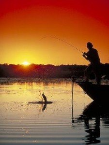 man fishing at sunset